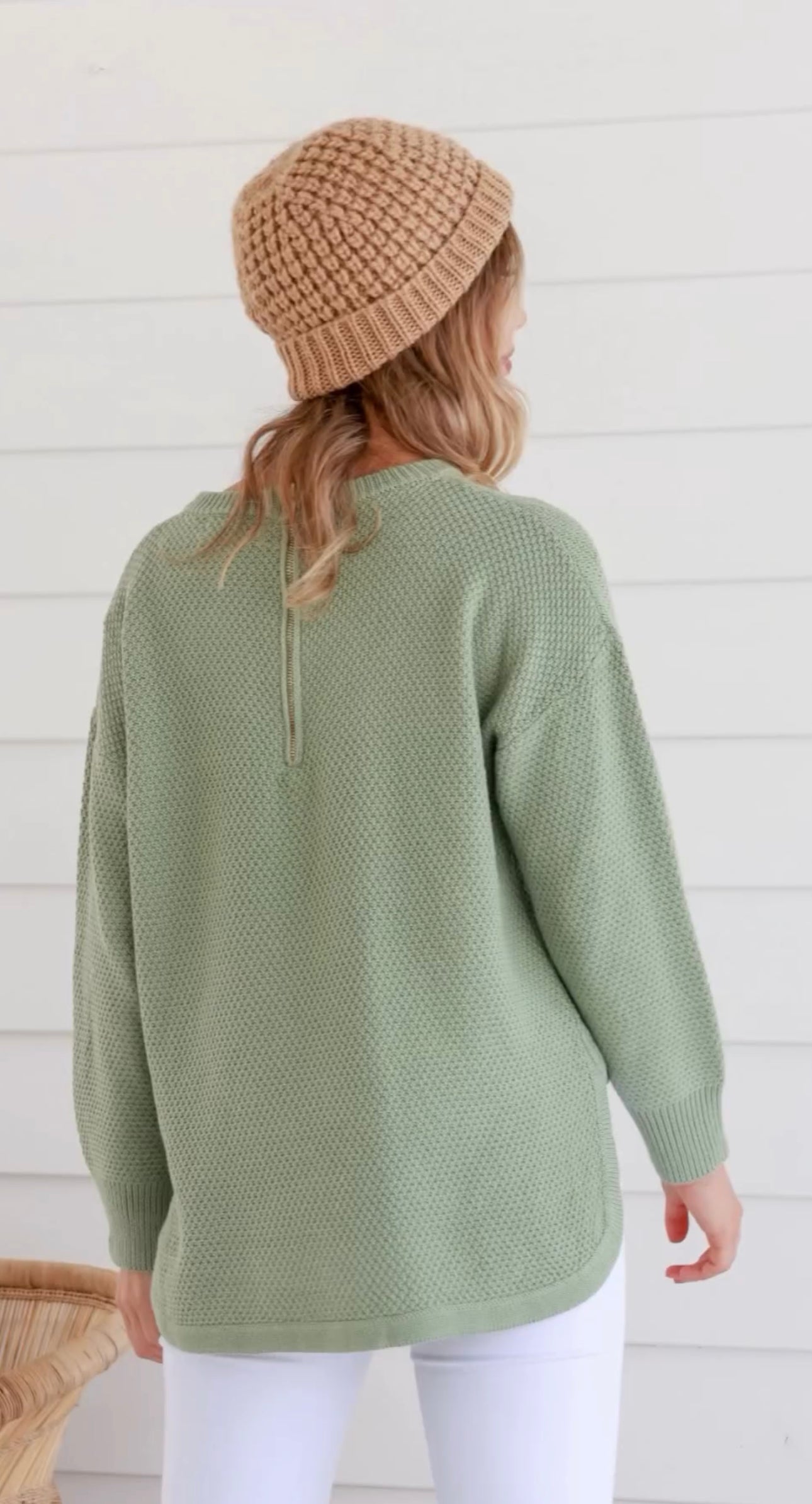 sage green knit jumper with high low fit and zip at the back