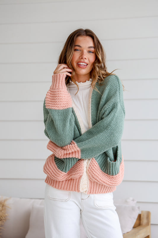 a mix of sage green and blush pink in a gorgeous oversized crochet knit cardigan style with pockets