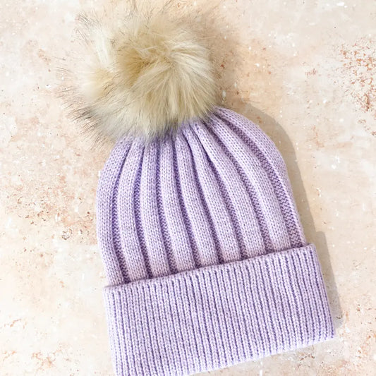 Adorable and warm pastel beanie cable knit with neutral pom pom faux fur