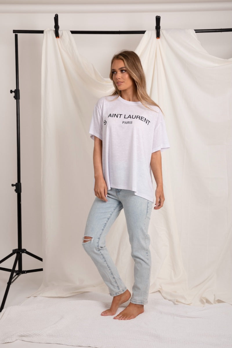 casual comfy white tee t-shirt that could be worn with jeans or dresses up with a skirt or leather pants. 