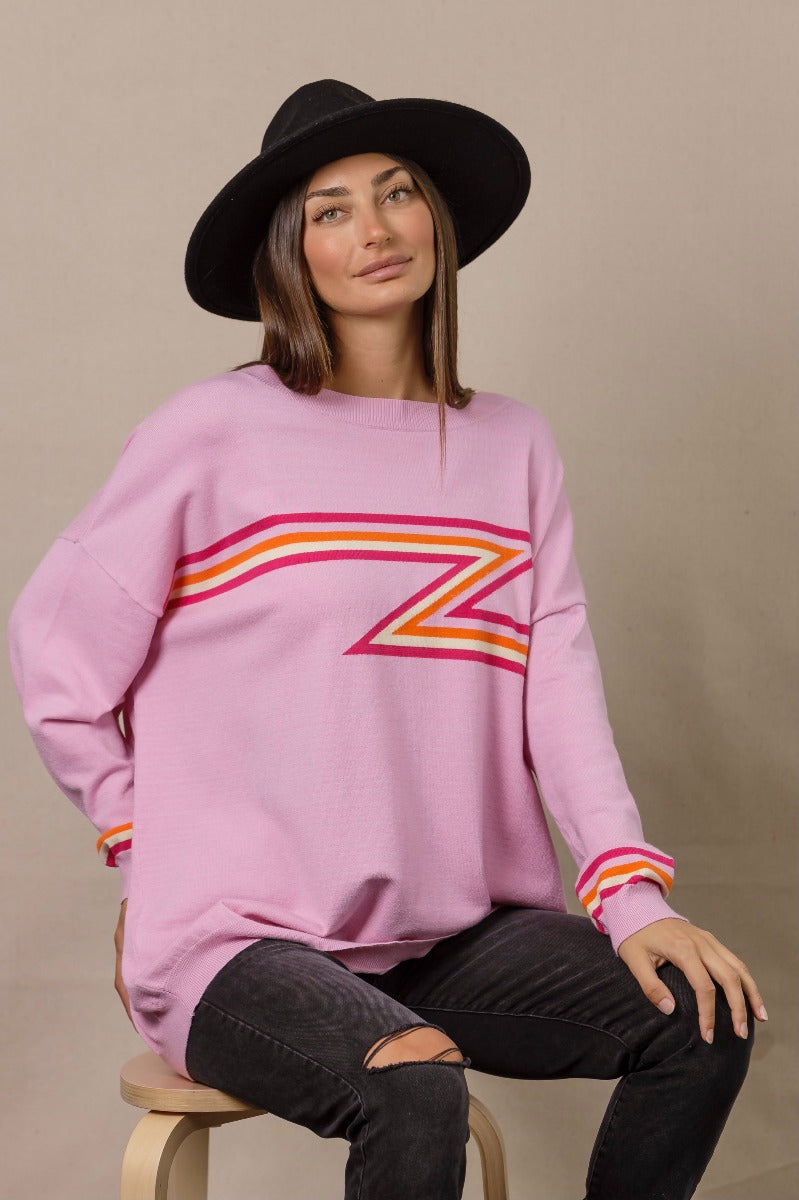 statement knit jumper in pink featuring pink, orange and white lightning pattern detailing